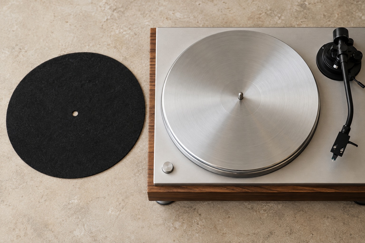 Felt record mat beside an uncovered turntable platter
