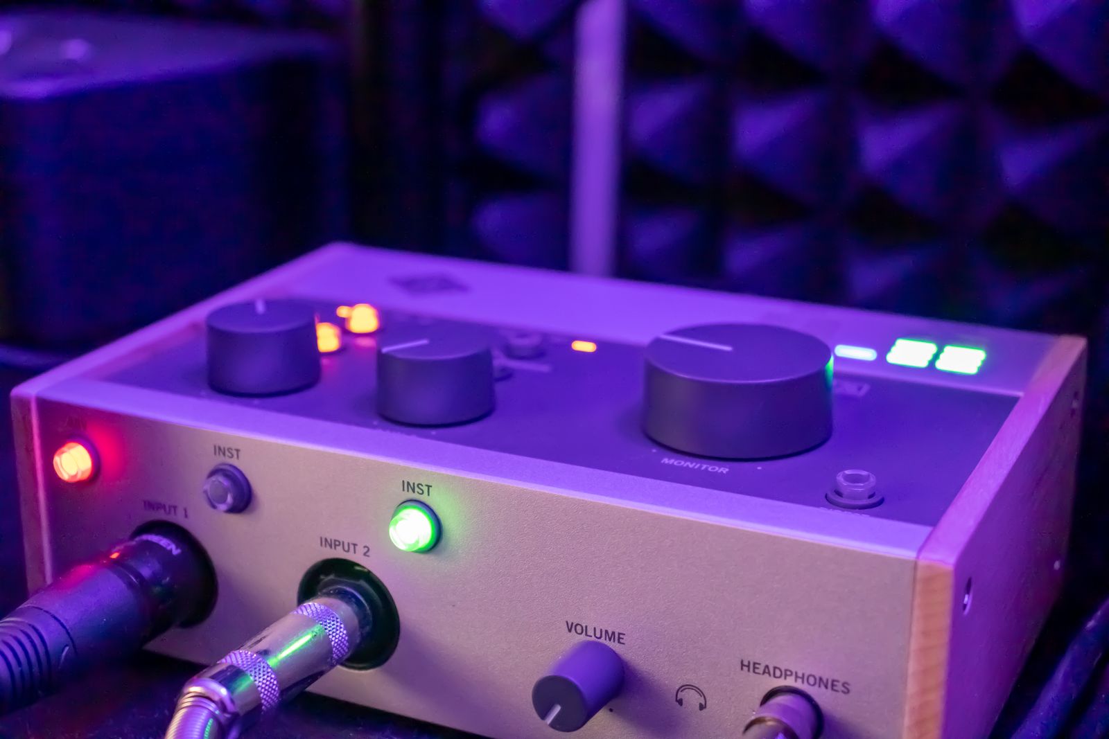 Front controls and connected cables on an audio interface