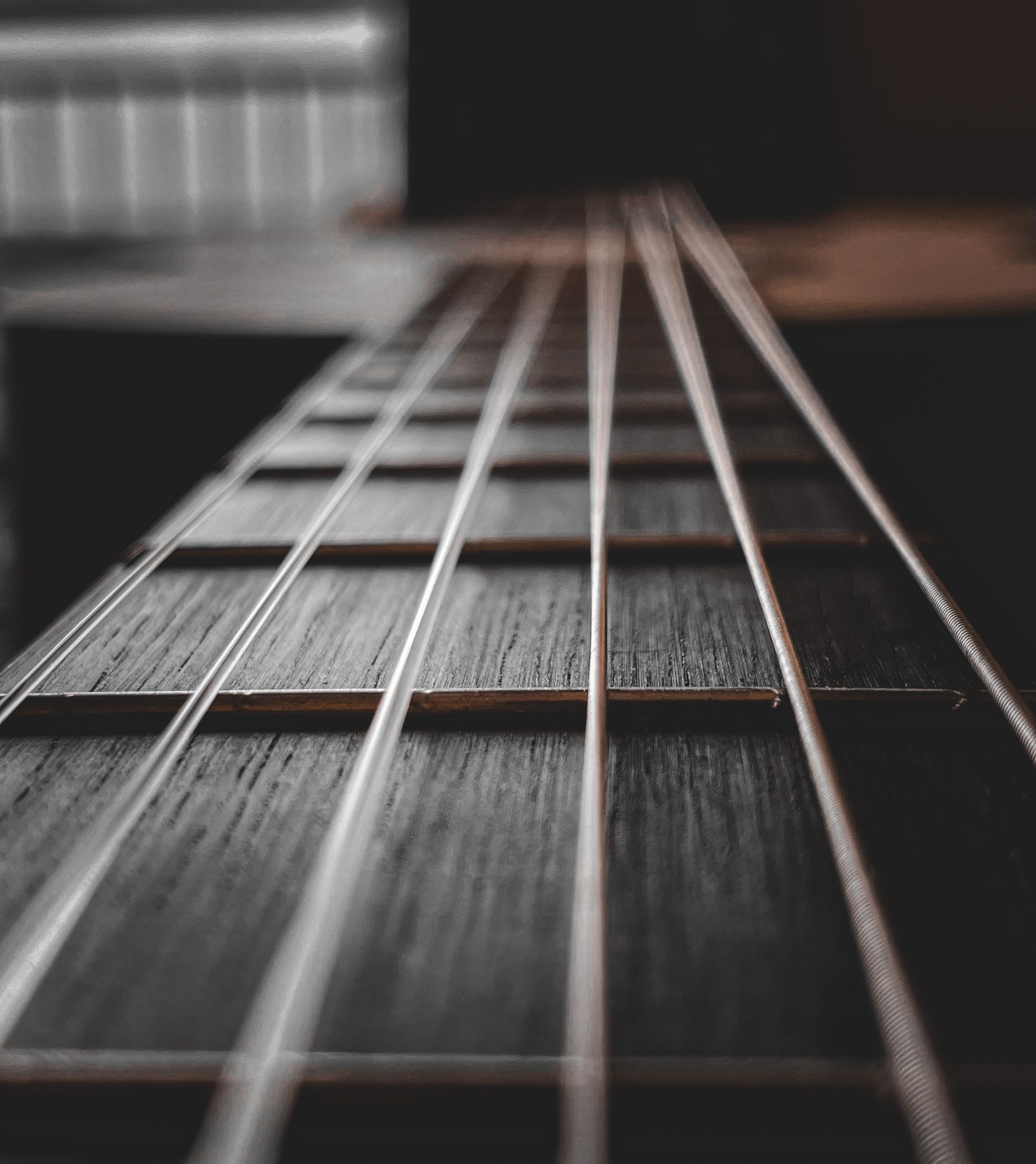 Close view along acoustic guitar strings