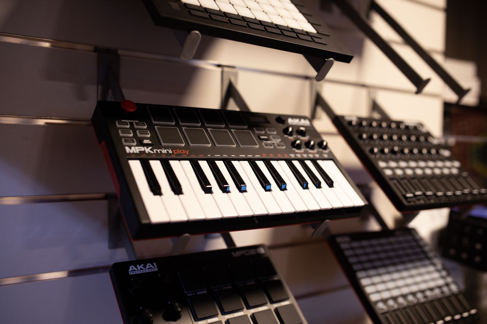 Small MIDI keyboards displayed on shelves